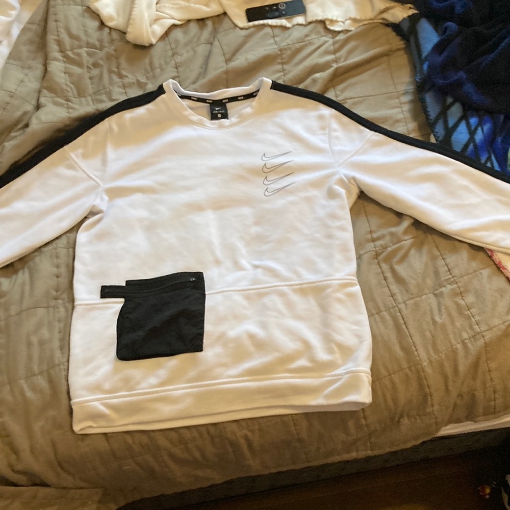 Size small can fit medium though white Nike sweater with pocket